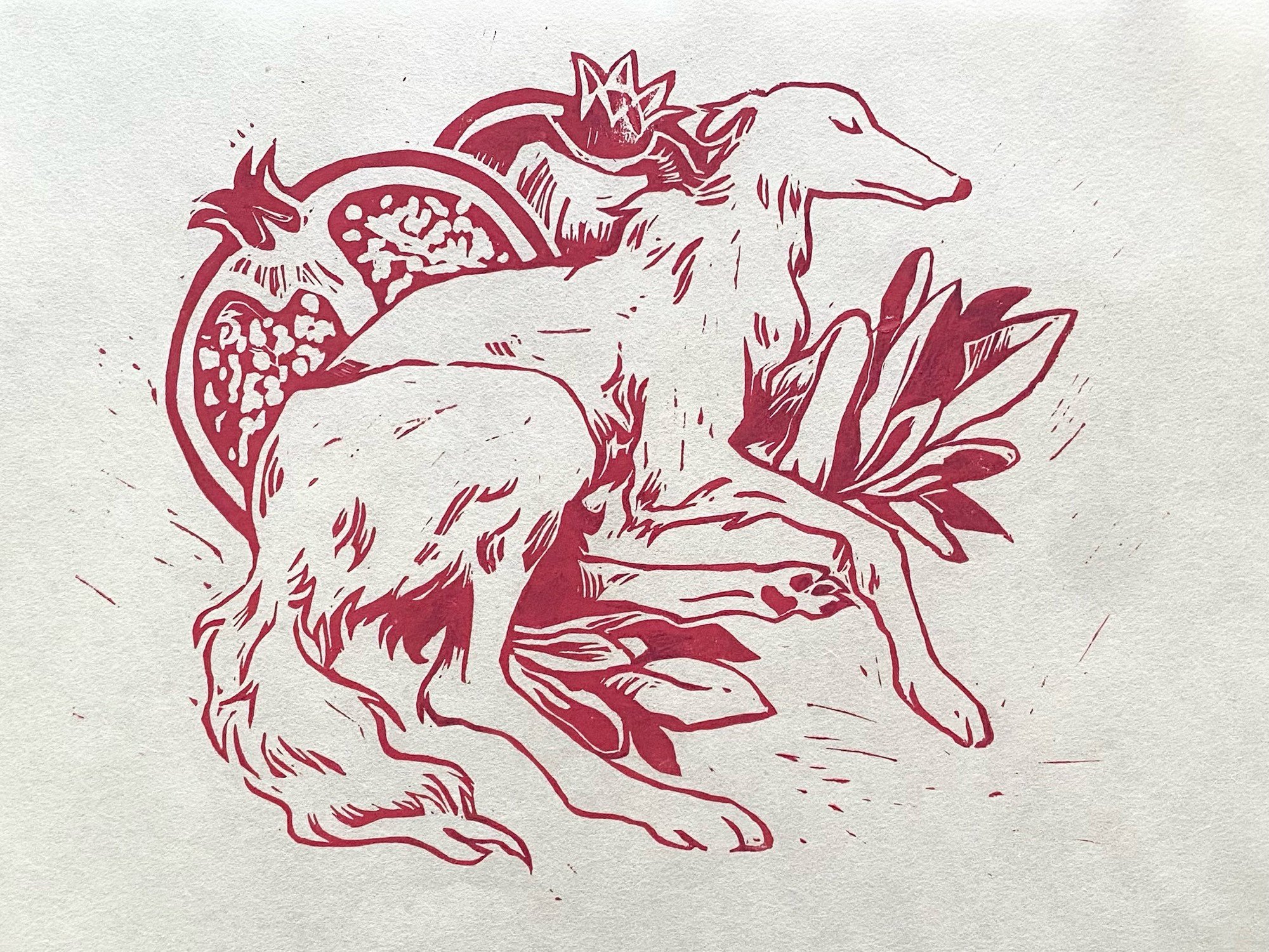 Linocut print on mulberry paper of a borzoi amongst pomegranates and foliage.